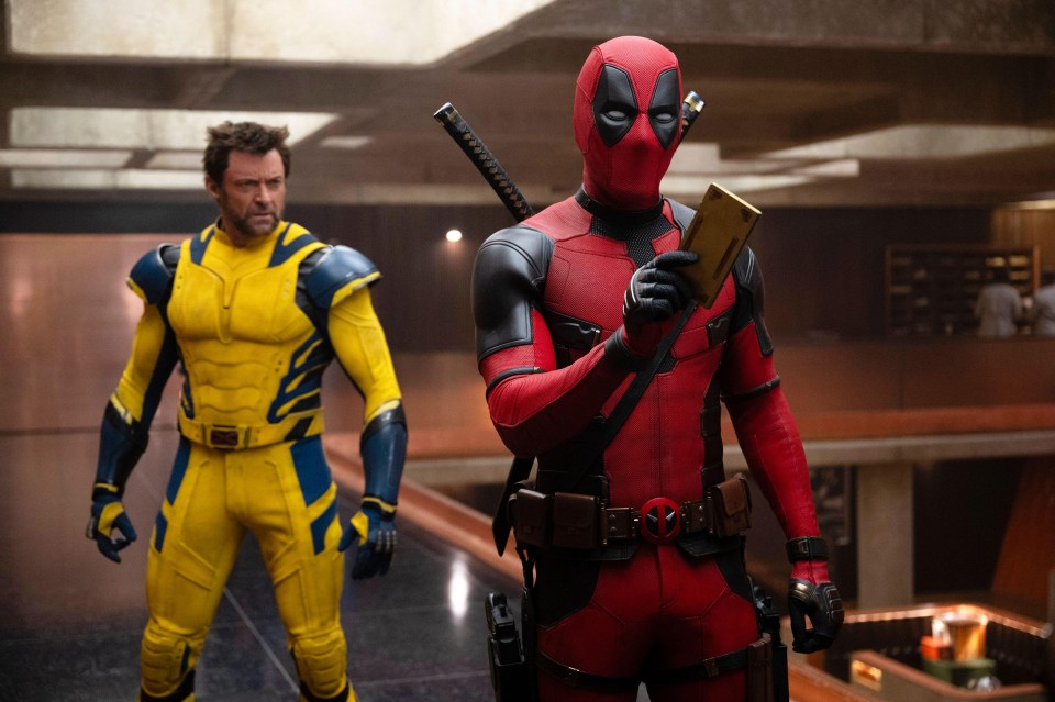 wolverine and deadpool are standing next to each other