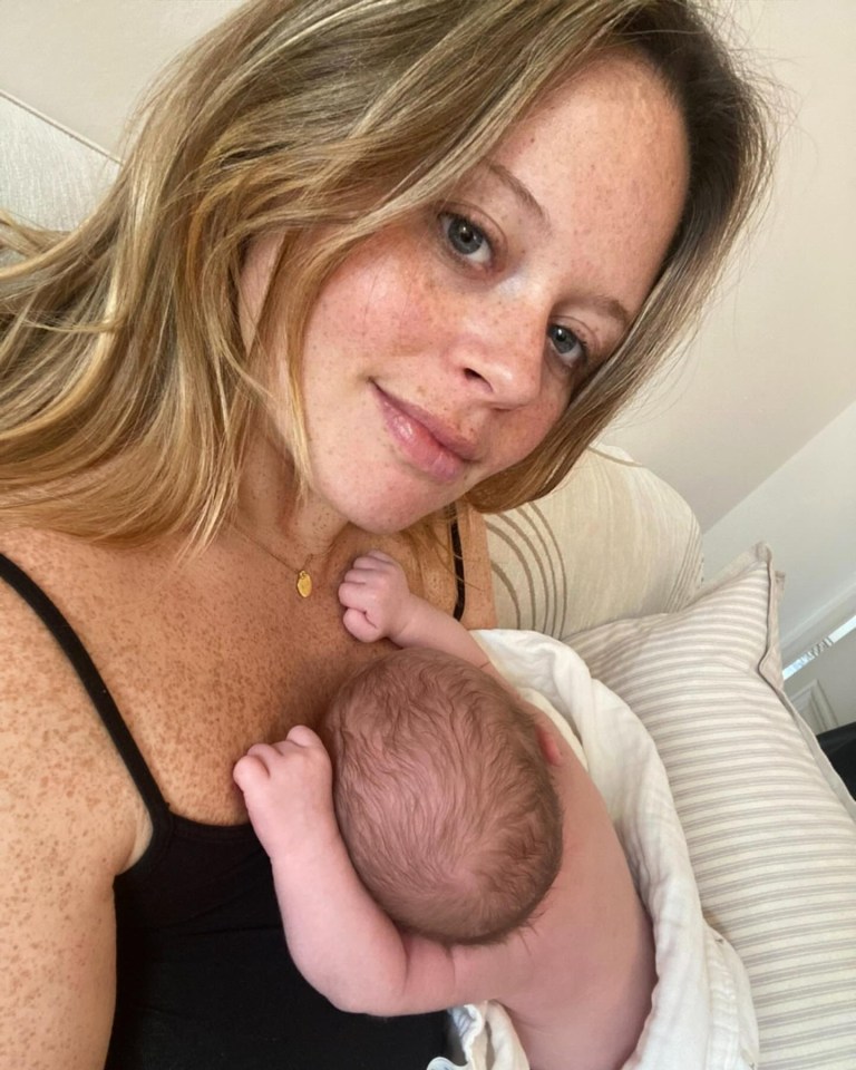 a woman is holding a newborn baby in her arms