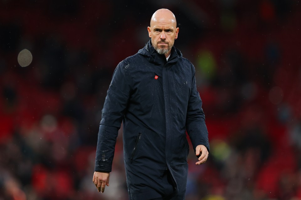 a bald man with a beard wearing a black jacket