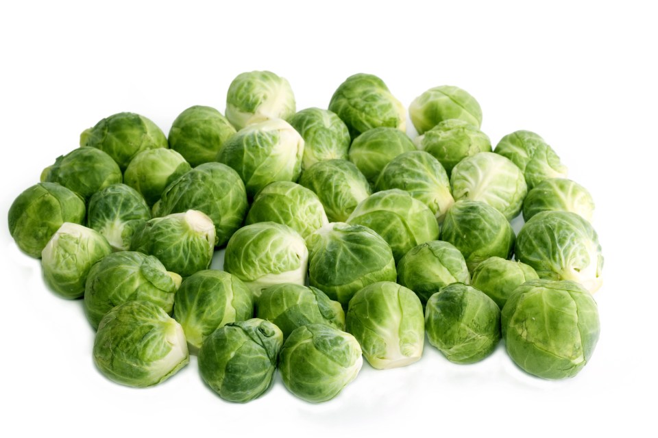 a pile of brussels sprouts on a white background