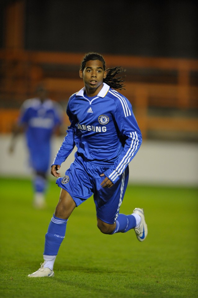 a soccer player wearing a blue samsung jersey is running on the field