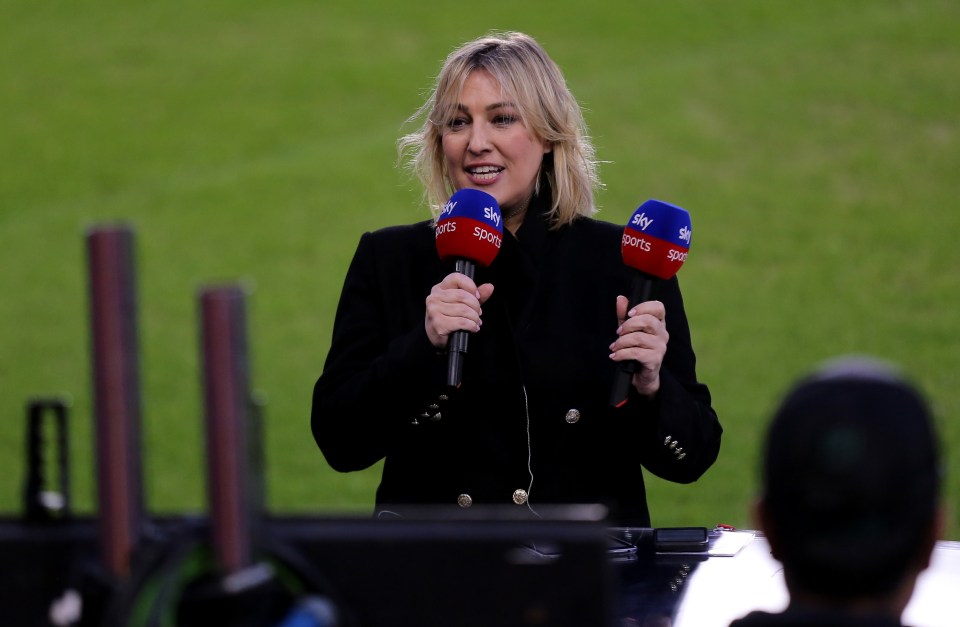 a woman is holding two microphones that say sky sports