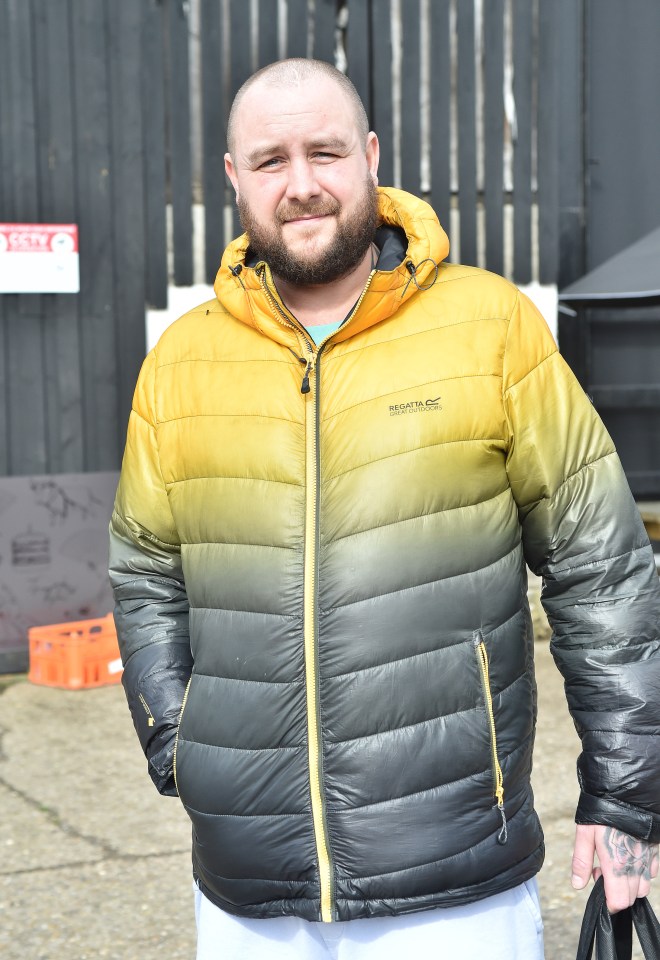 a man wearing a yellow and black regatta jacket