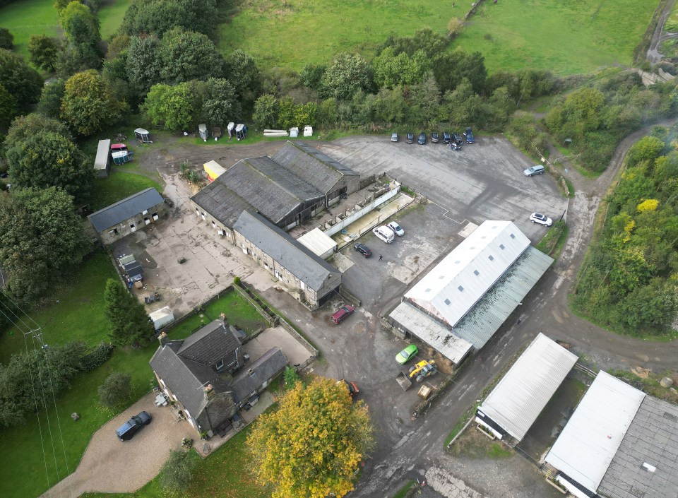 an aerial view of a farm with a lot of buildings