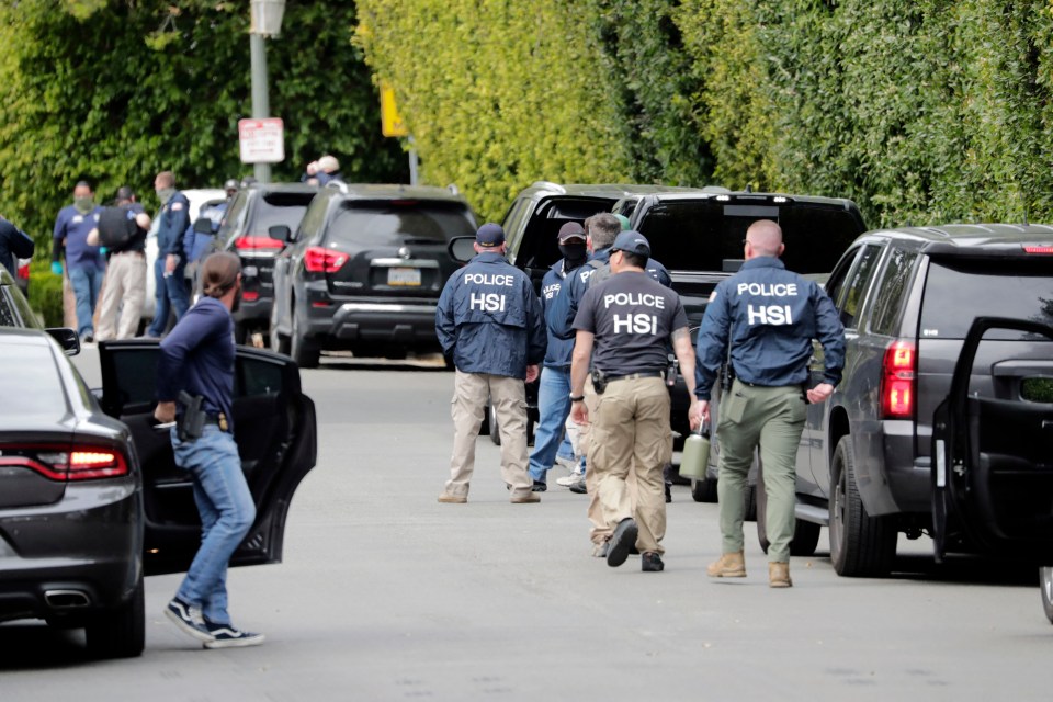 a group of police officers are walking down a street