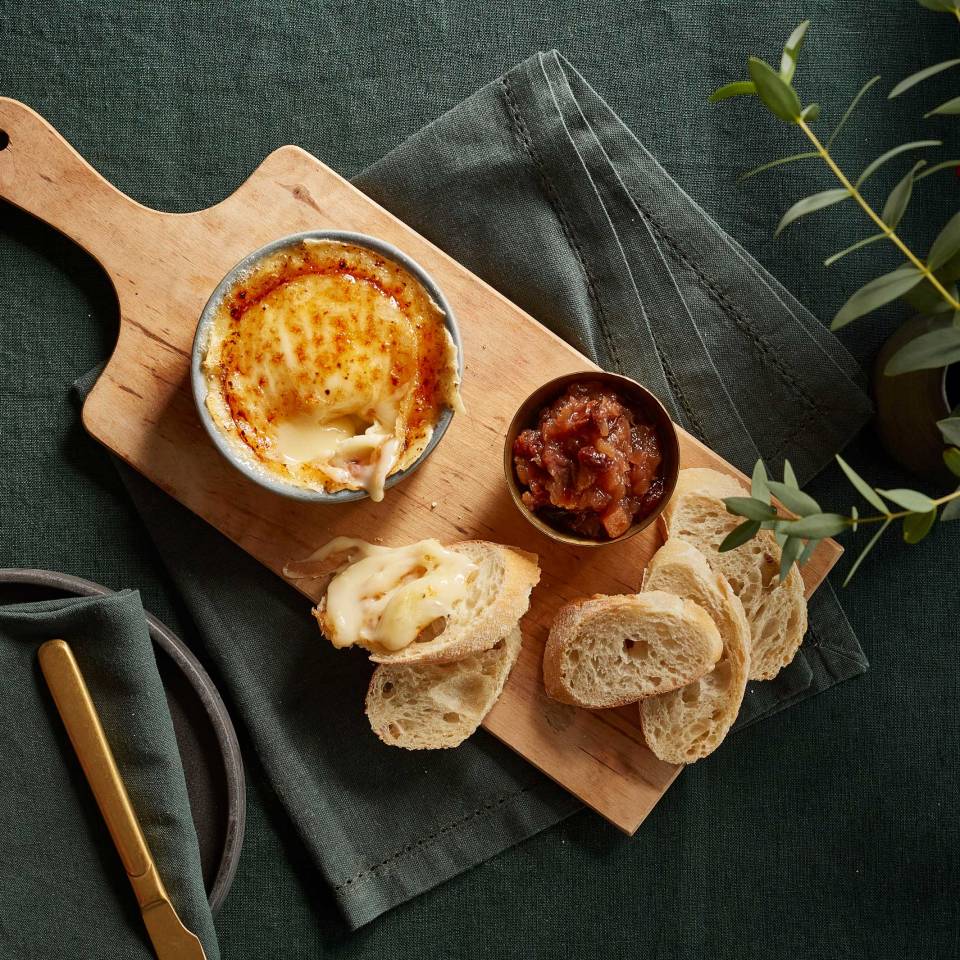 Brûlée Camembert is sprinkled with sugar and caramelised to create a hard sweet crust, with grape chutney