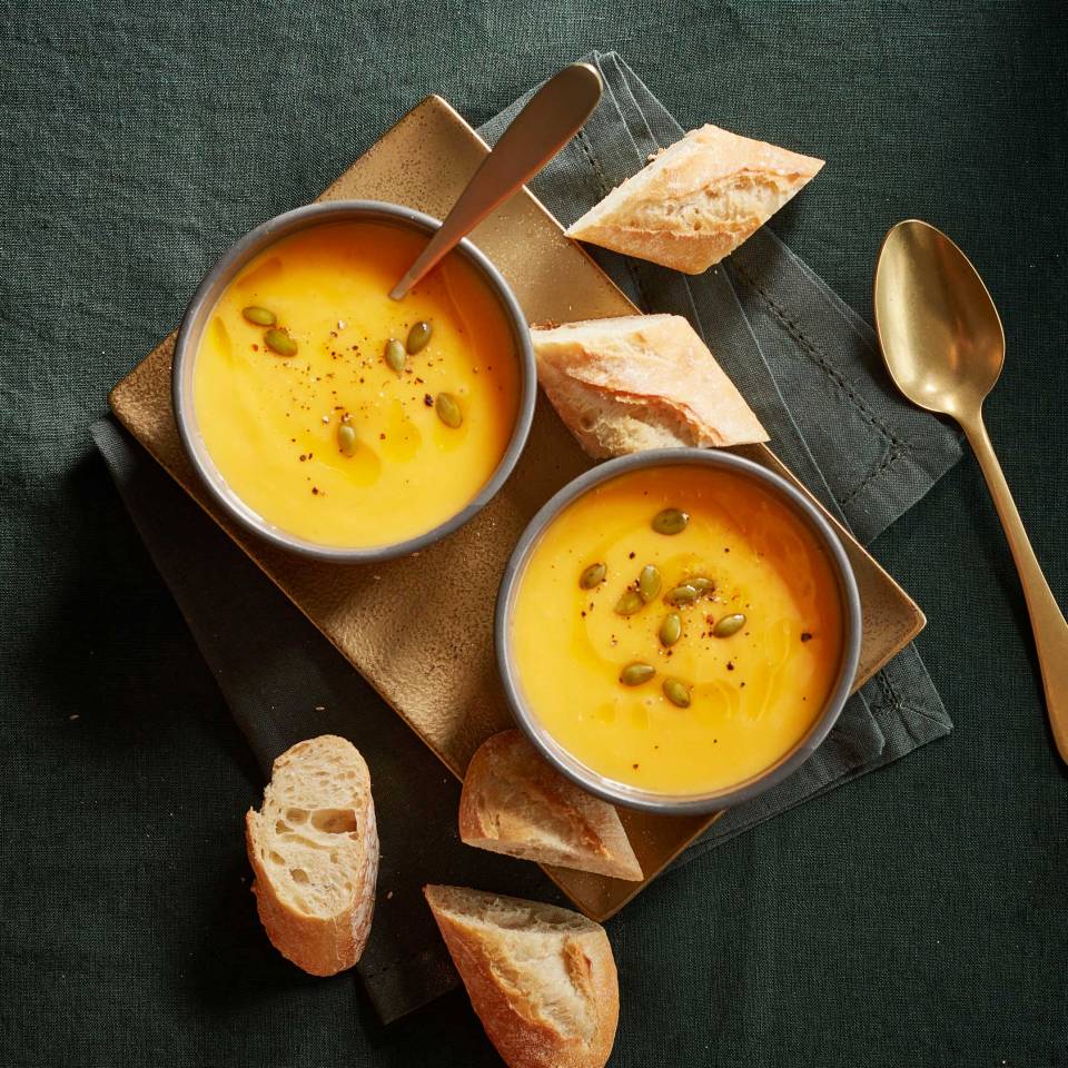 Truffled Pumpkin Soup topped with crumbled chestnuts and pumpkin seeds