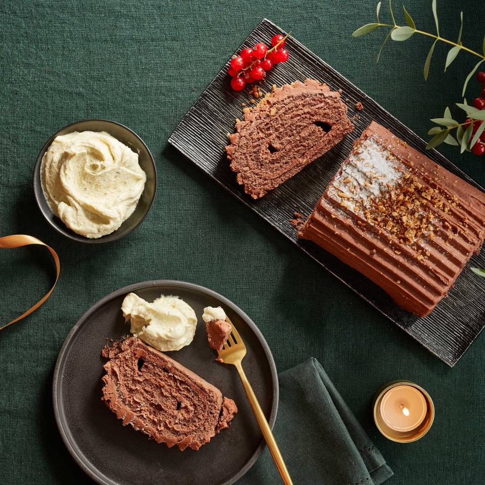 Bûche de Noël, a traditional chocolate roulade with pistachio cream