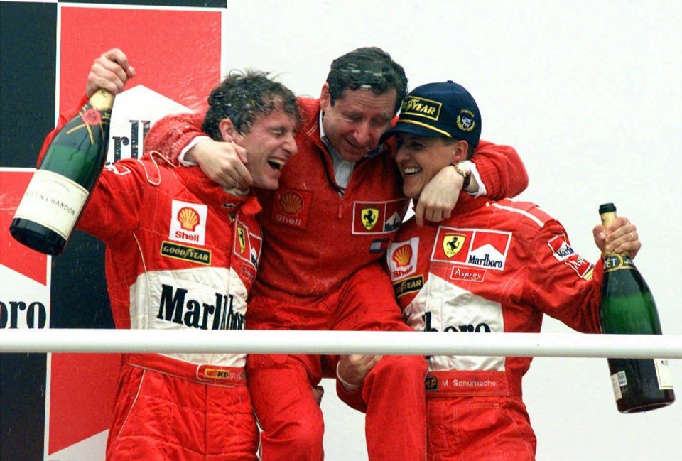 Schumacher, right, celebrated a double podium with Ferraro's Eddie Irvine, left