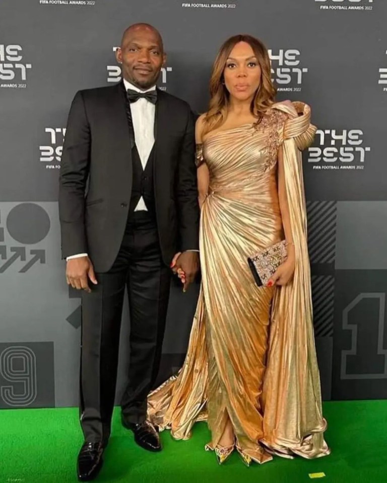 a man and a woman pose for a photo at the fifa football awards