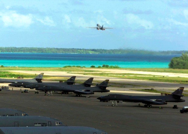 several u.s. air force planes are parked on a runway