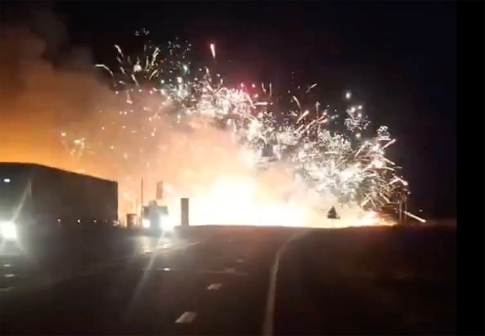 Four people died when a car collided with a truck loaded with fireworks triggering huge pyrotechnic explosions