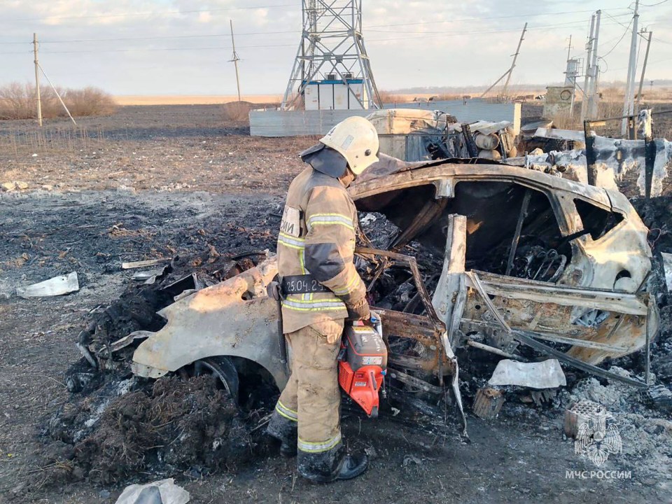 A firefighter inspecting the damage the morning after the deadly crash