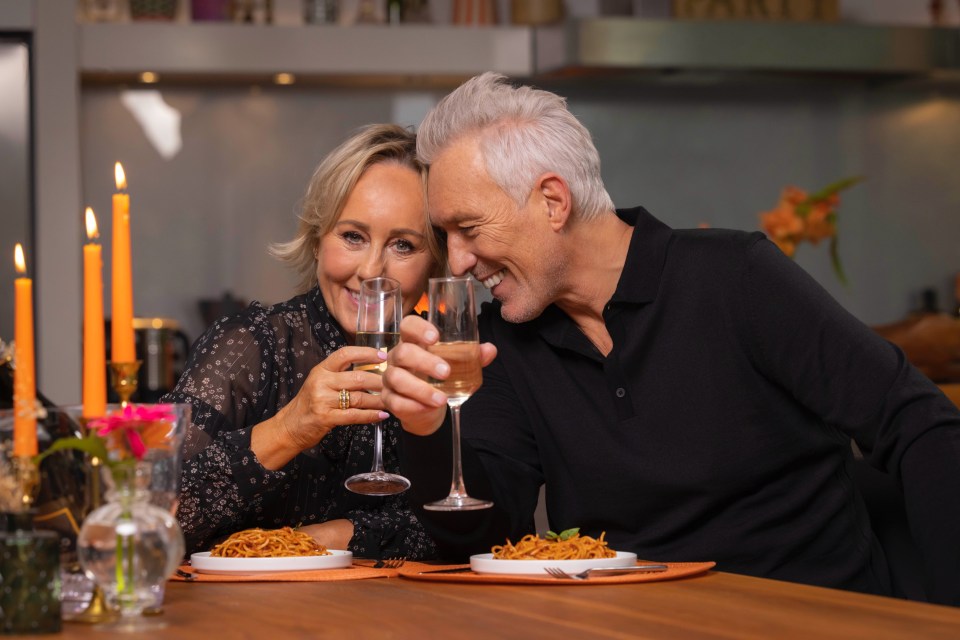 a man and a woman toasting with wine glasses