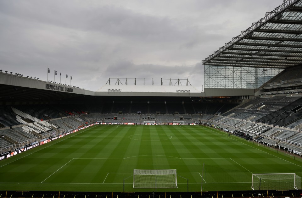 an empty soccer stadium with the word newcastle written on the side