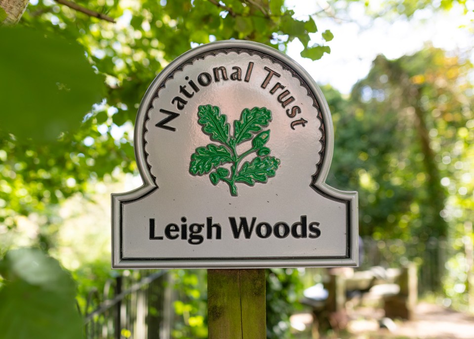 a sign that says national trust leigh woods on it