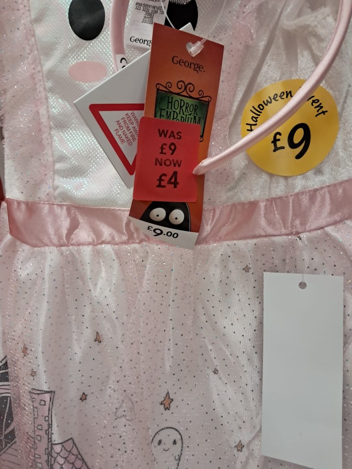 a pink dress with a tag that says george on it