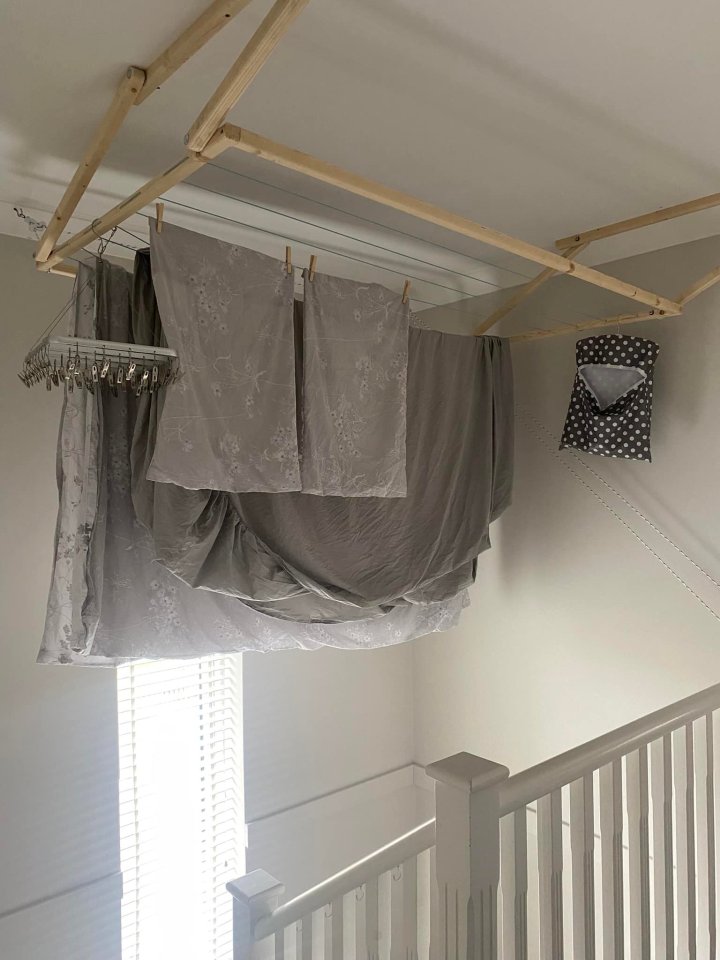 With her savvy trick, she can dry her clothes out of the way, above her stairs