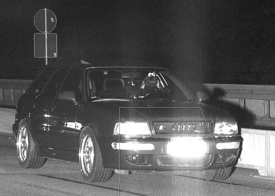 a black and white photo of an audi car