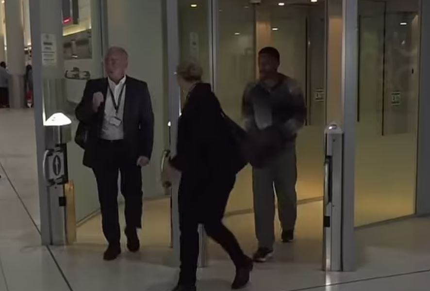 Filly was flanked by officials as he walked through Perth airport after being detained