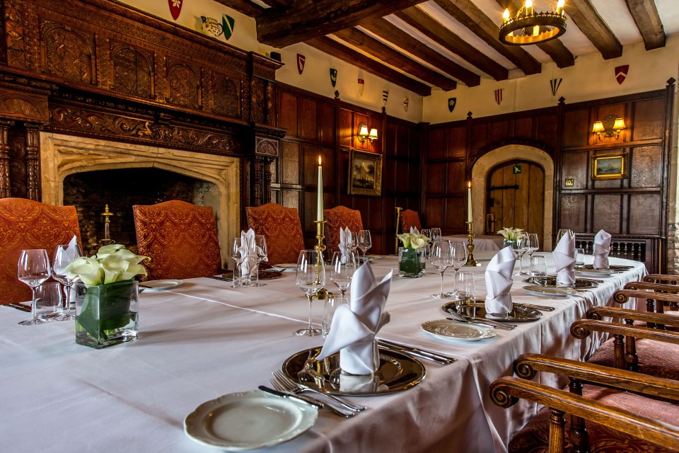 a long table with plates glasses and napkins on it