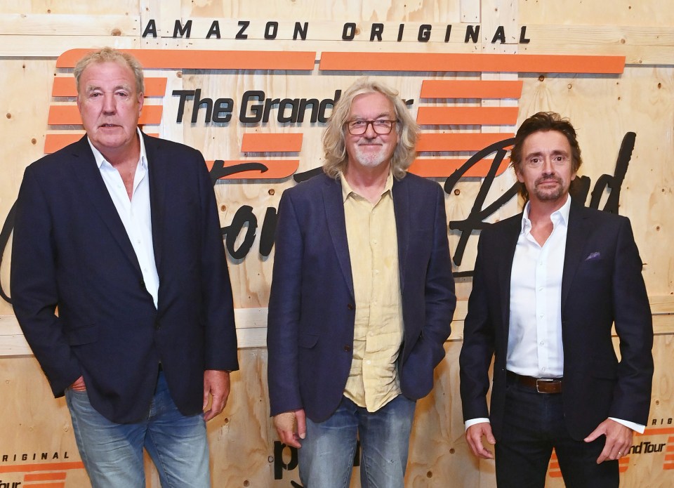 three men stand in front of a sign that says amazon original