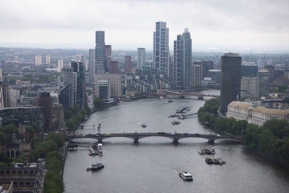 a large body of water with a city in the background