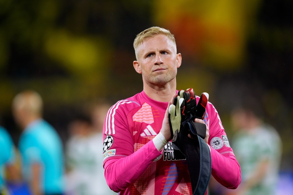 a soccer player wearing a pink adidas jersey