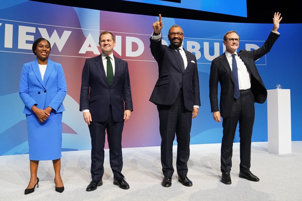 a group of people standing in front of a sign that says view and build