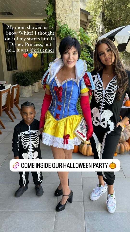 a woman in a snow white costume stands next to two other women