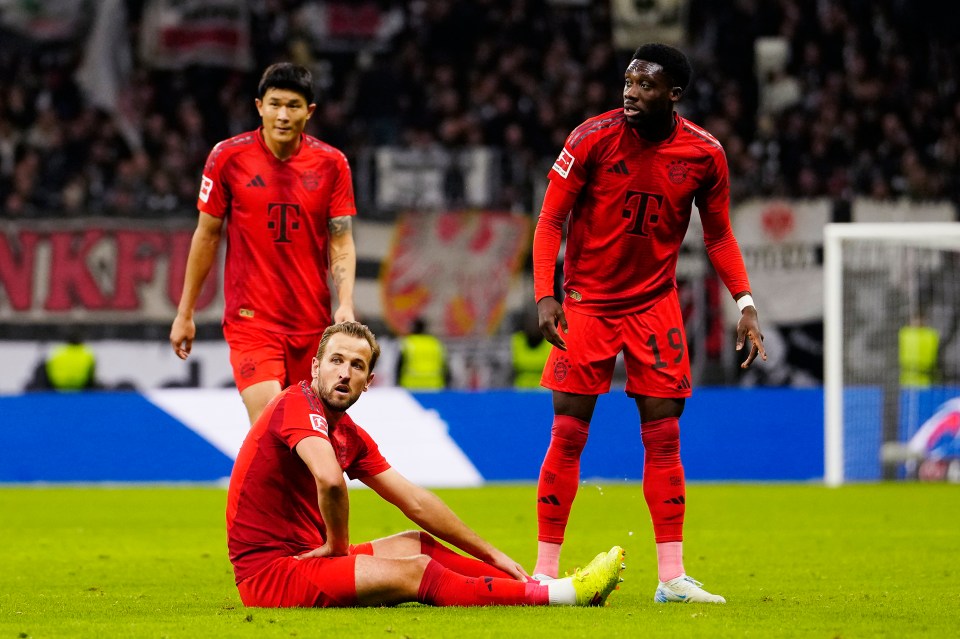 Team-mates Kim Min-Jae and Alphonso Davies look on as Harry Kane went down for Bayern and had to be replaced in the Bundesliga draw at Eintracht