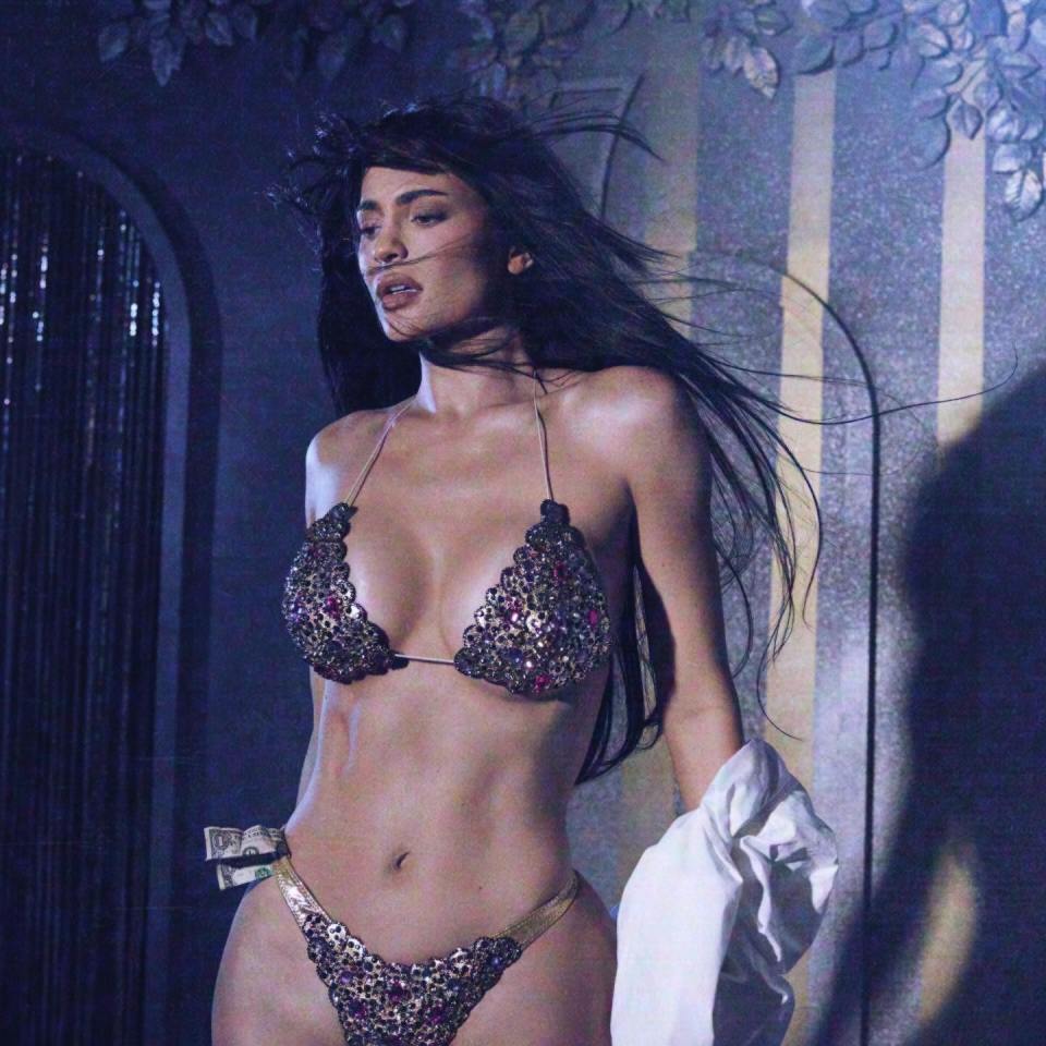 Kylie Jenner strips off to recreate Demi Moore's famous Striptease scene