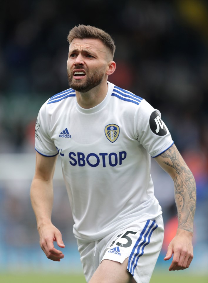 soccer player wearing a white jersey with the word sbotop on it