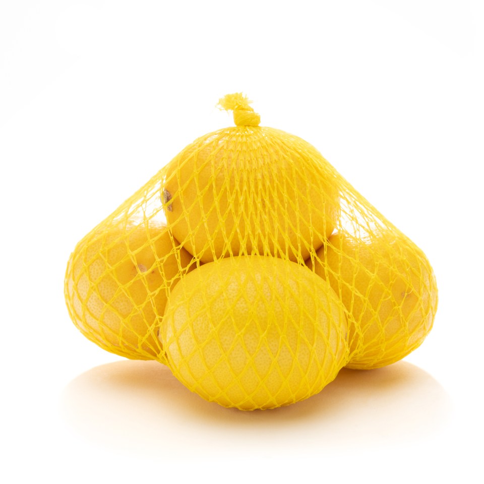 Packaging, such as net bags around lemons and limes, is brighter than the item to make it more appealing