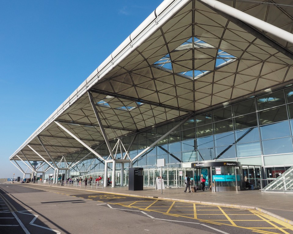 a large building with a sign that says departures