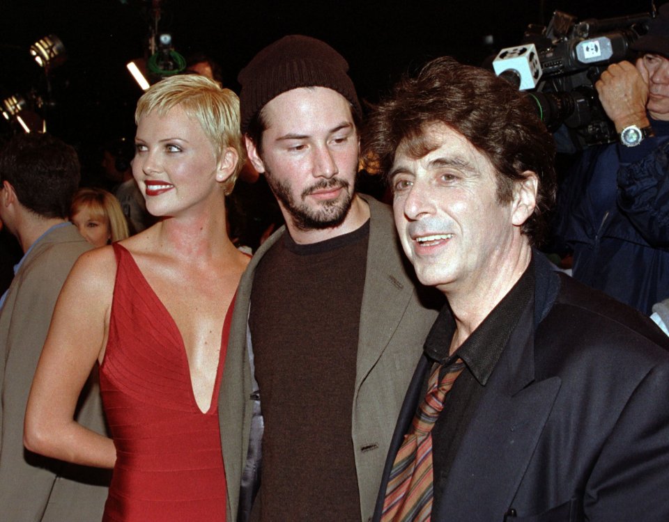 Keanu pictured in 1997 with Charlize Theron and Al Pacino