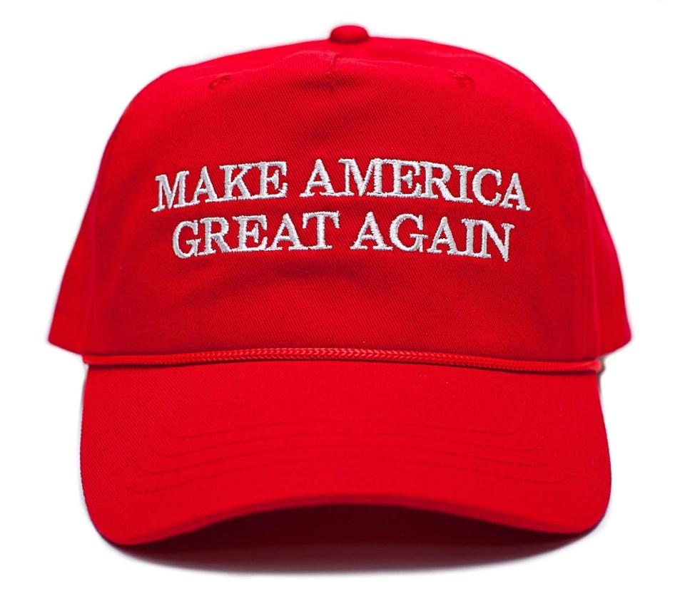 a red baseball cap that says make america great again