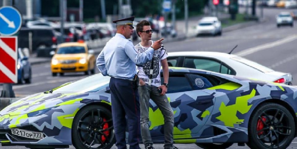 Maksim and his supercar, after being stopped by police