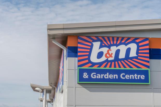 a b &amp; m store has a sign that says garden centre