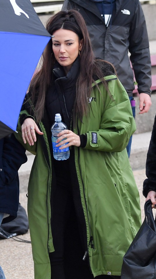 Michelle Keegan in between takes whilst arriving for Brassic in her Dry Robe.