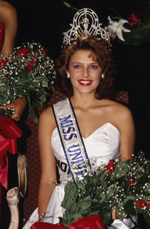 a woman wearing a sash that says miss universe