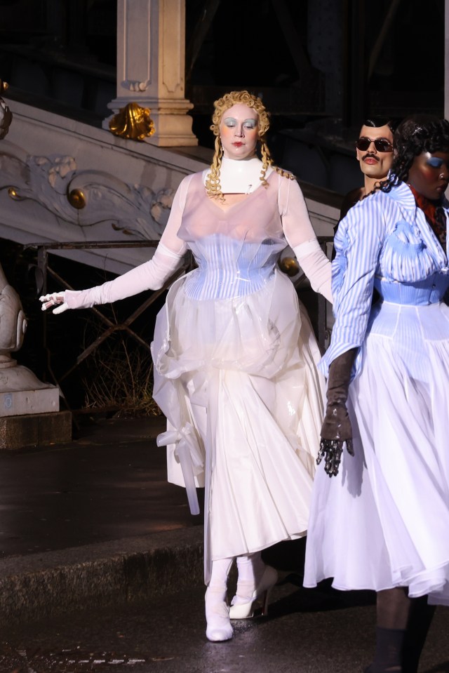 Maison Margiela’s Creative Director John Galliano sent Gwendoline Christie down the catwalk dressed in a clear, tiered latex gown