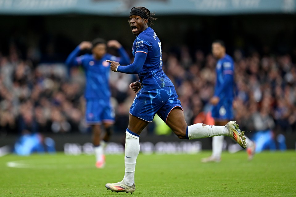 a soccer player in a blue jersey with the number 1 on it