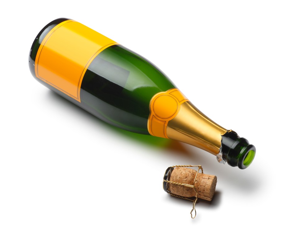 a bottle of champagne with the cork missing