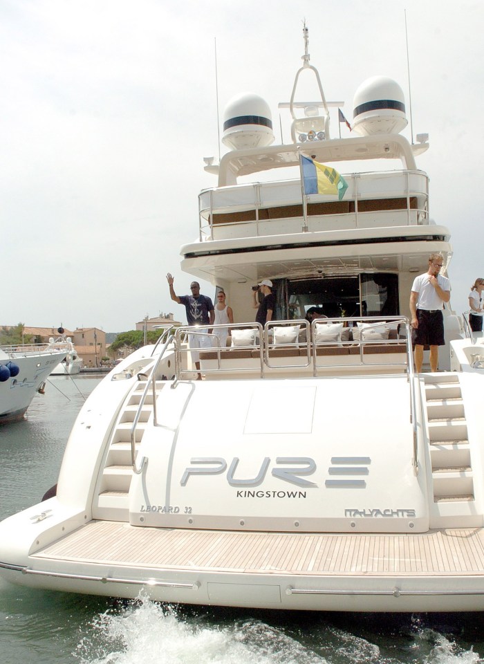 a large white yacht with the word pure on the back