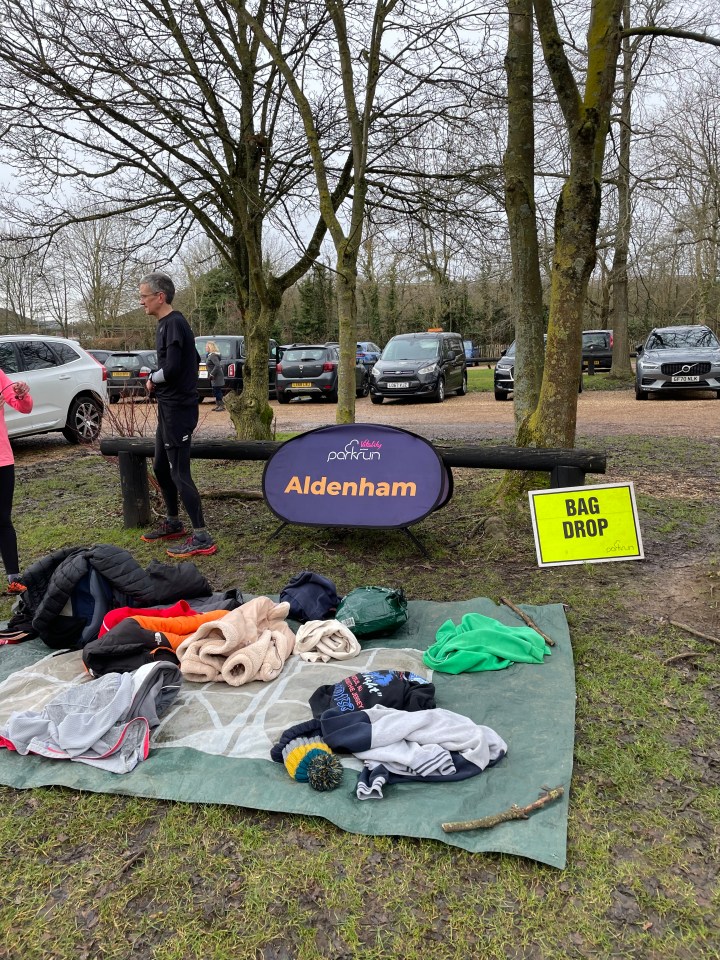 A tarpaulin to store coats and bags on at Aldenham parkrun in Borehamwood, Hertfordshire