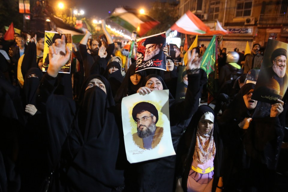 People gather outside the British Embassy in Tehran to stage a demonstration in support of Iranian missile attacks on Israel