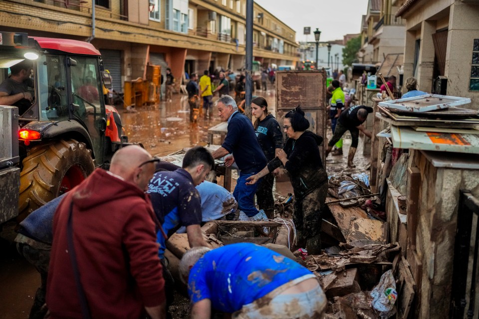 Locals are getting their hands dirty but more rain is on the way