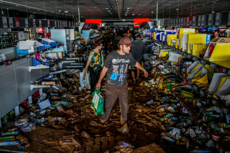 People pick up goods in a supermarket