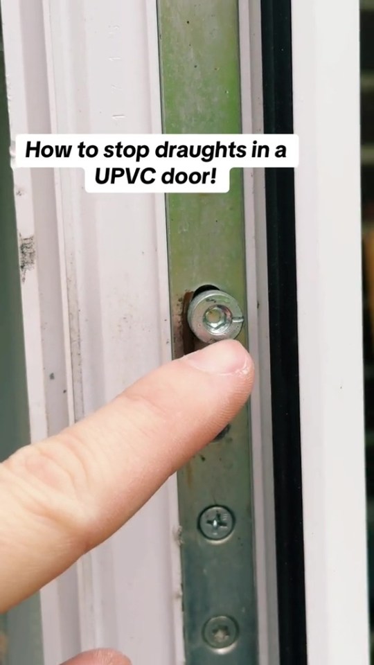 a person 's finger is pointing at a screw on a door that says how to stop draughts in a upvc door